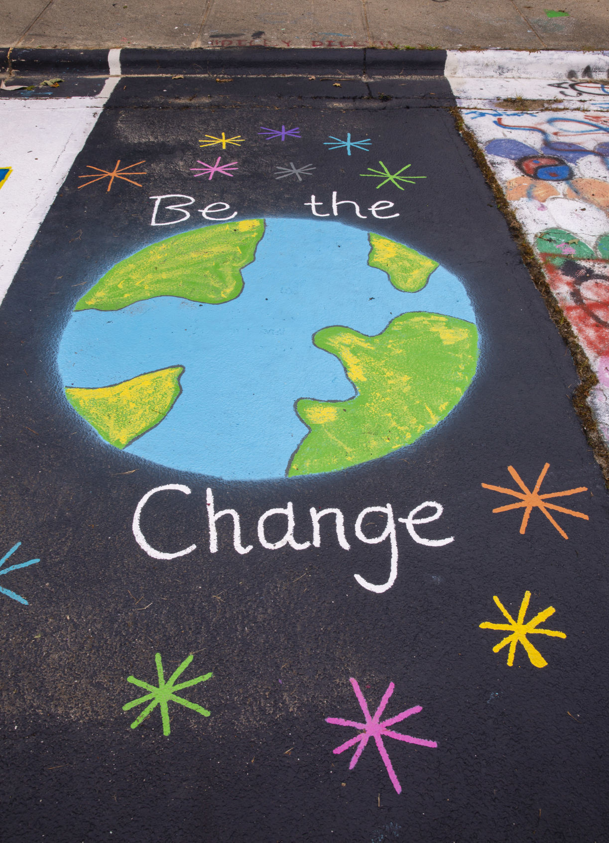 Students painting their parking spaces